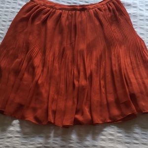 Urban outfitters sheer burnt orange mini skirt.